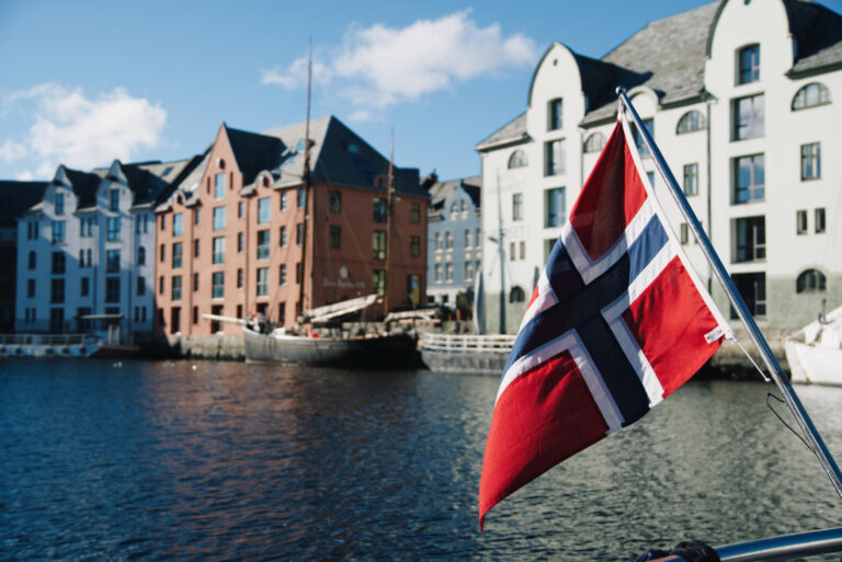 Norwegian flag in front of Brosundet, Ålesund.